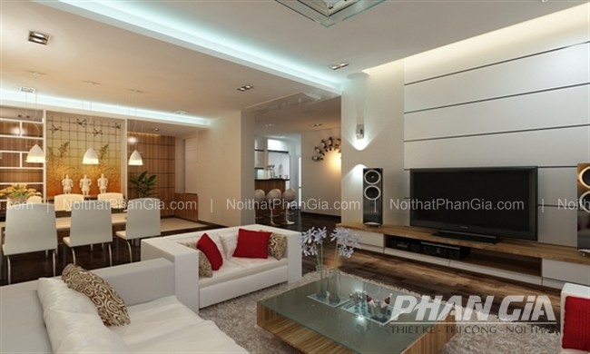 Thiết Kế Nội Thất Biệt Thự Ánh Dương 3 Phòng khách mở phong cách châu Âu với sofa trắng, gối đỏ tạo điểm nhấn, bàn kính gỗ