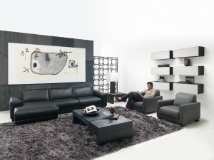 Phòng khách trắng-đen tối giản với sofa da đen, thảm xù xám và kệ treo tường